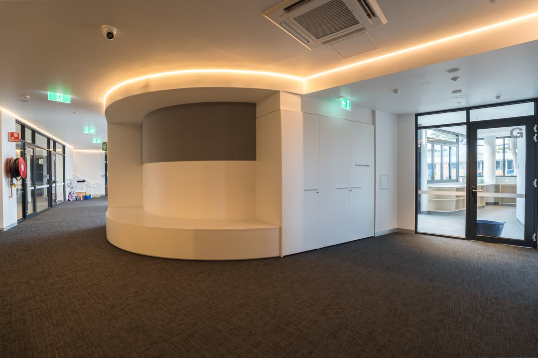 Coastal kitchen with custom pendant lighting and LED downlights