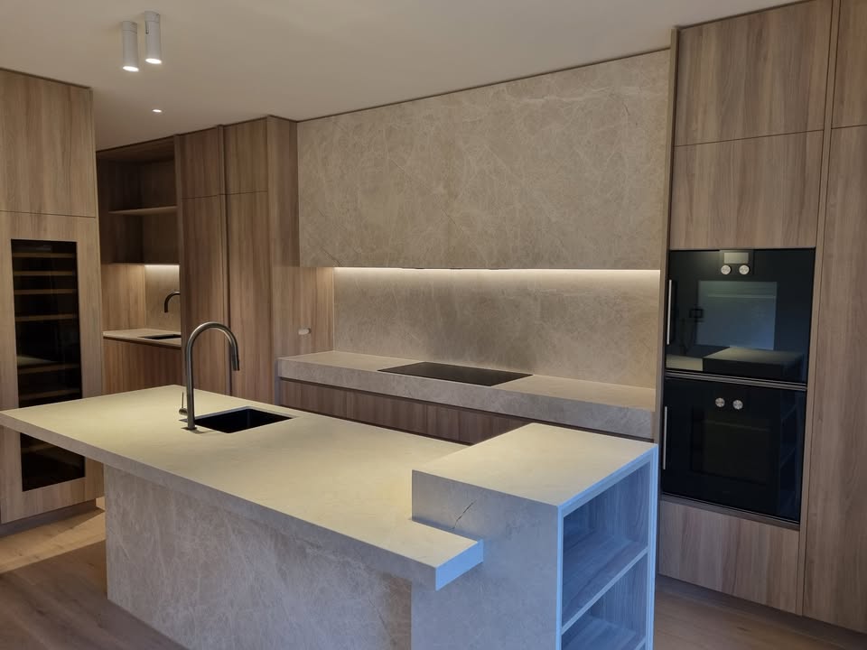 Modern kitchen and dining area with designer lighting